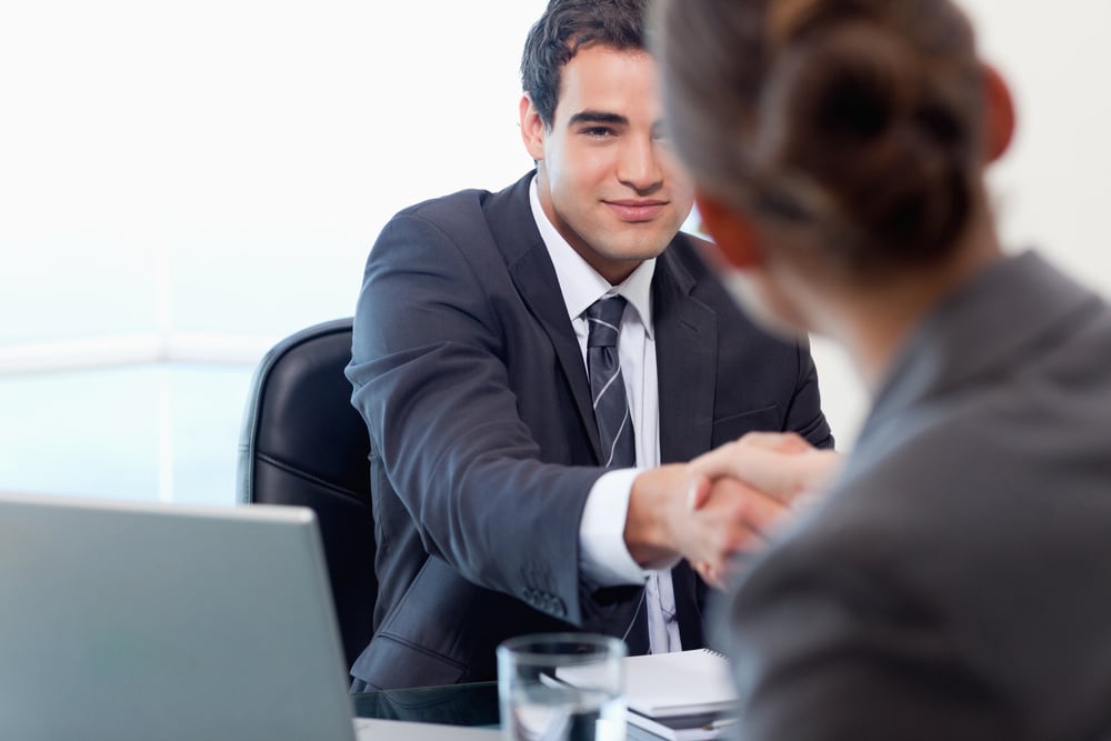 Manager interviewing a female applicant in his office Manager interviewing a female applicant in his office